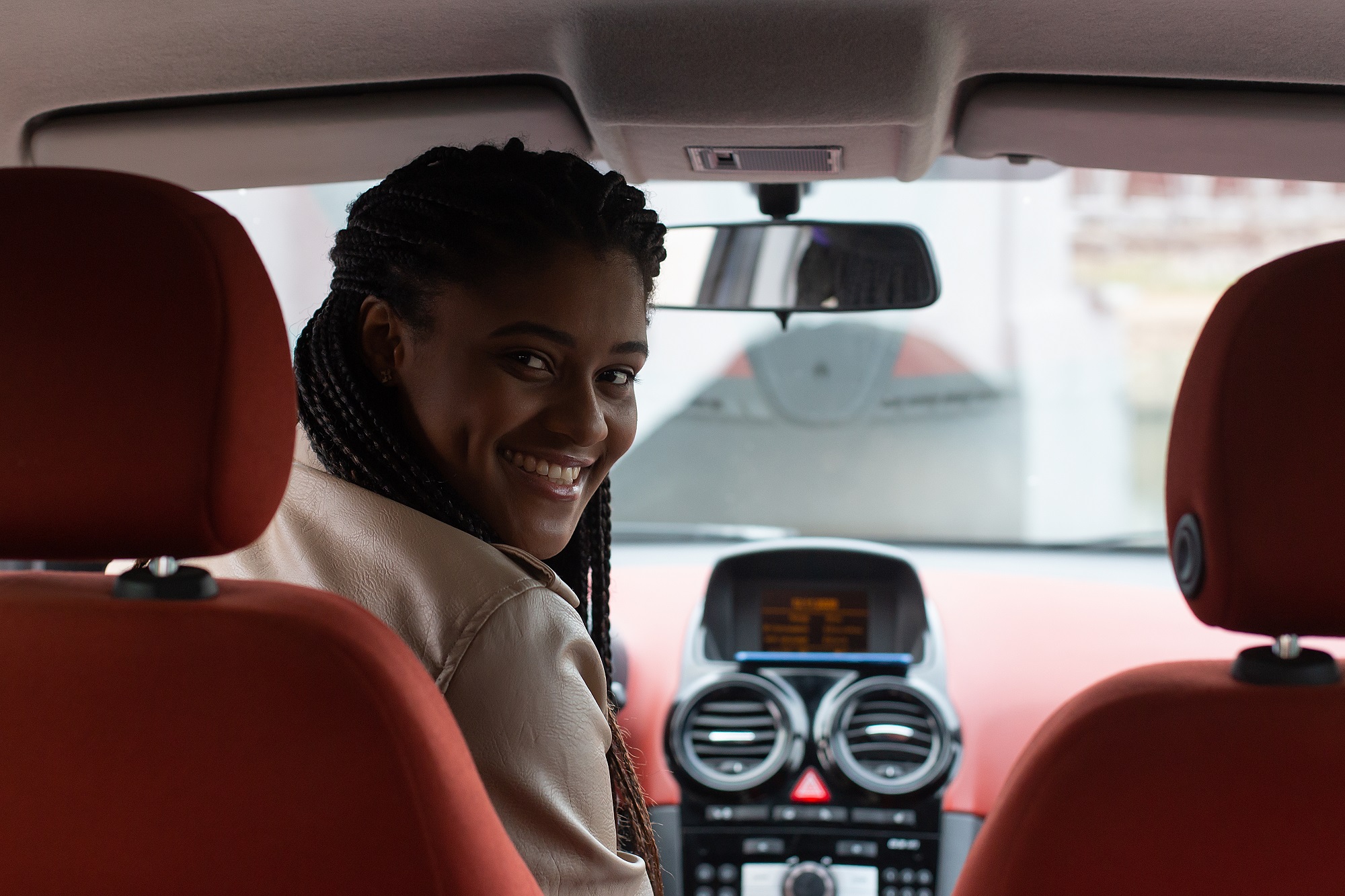 //www.startdriving.nyc/wp-content/uploads/2021/05/happy-african-american-woman-driving-car.jpg